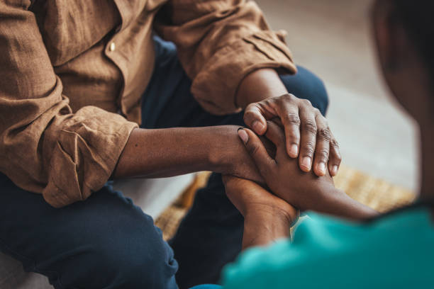 A DMMA caregiver working closely with a client