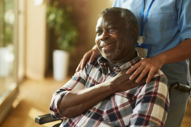 A DMMA support worker smiling with a young client